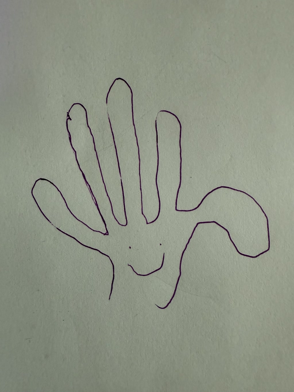 The image depicts a simple line drawing of a hand. The outline of the hand is crudely sketched with a purplish hue. The fingers and palm are clearly visible, but the drawing is not detailed and appears as a basic sketch. There is no other text or elements present in the image.